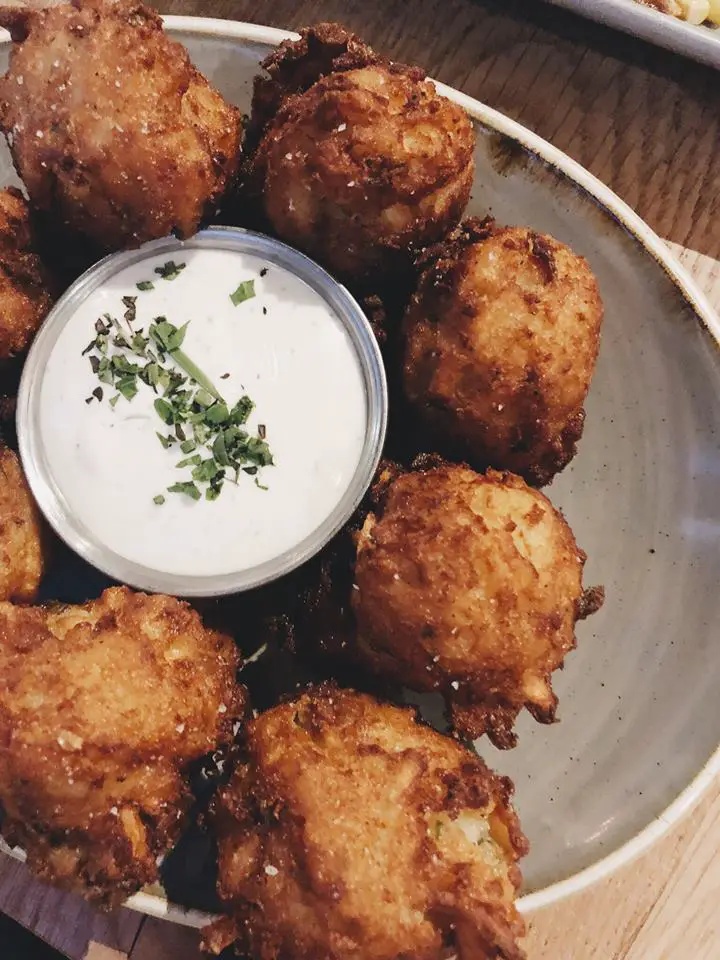 Tater tots, filled with yukon gold potatoes, bacon, cheddar, scallion, served with house ranch at LouVino's in Louisville