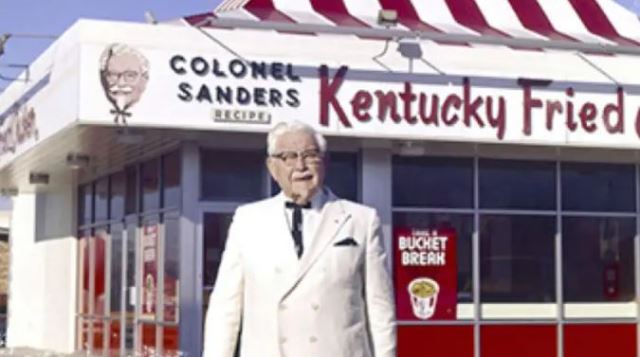 Colonel Sanders in front of the First KFC Franchise Location